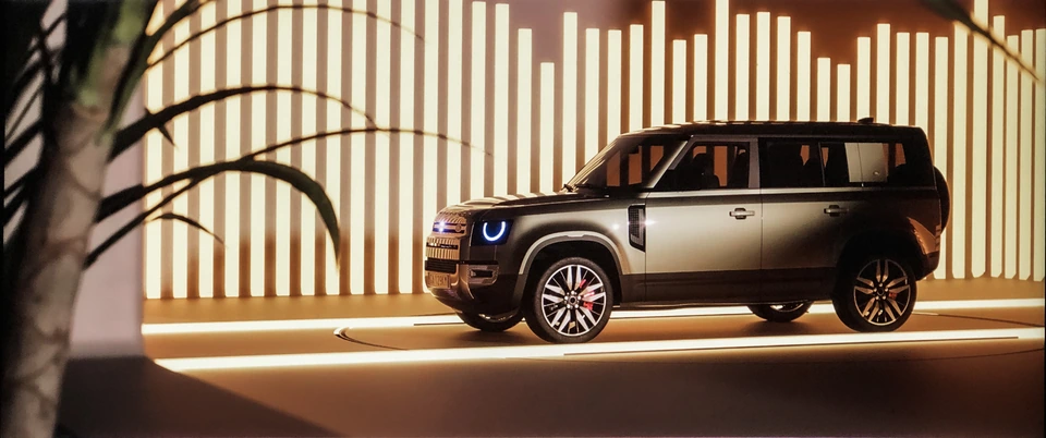 Defender — warm architectural light and side profile